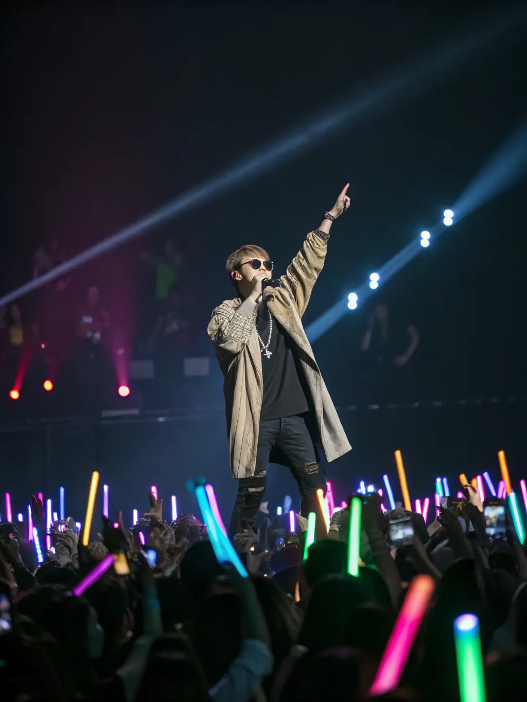 A vibrant image of a music artist performing on stage, with a large, engaged crowd, representing the impact of effective music marketing.